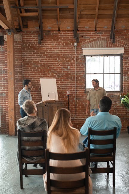 pexels photo 5756752 5756752 Adults attending a casual learning session in a rustic brick interior.
